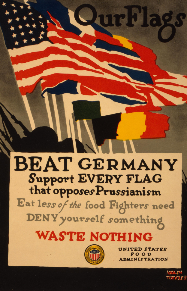 Ein Plakat mit einer roten, weißen und blauen Flagge mit einem weißen Stern, begleitet von fettem schwarzem Text, der "Unsere Flaggen schlagen Deutschland - Stützt jede Flagge, die sich gegen Preußentum wehrt" lautet, mit einem weißen Rand um den Text.