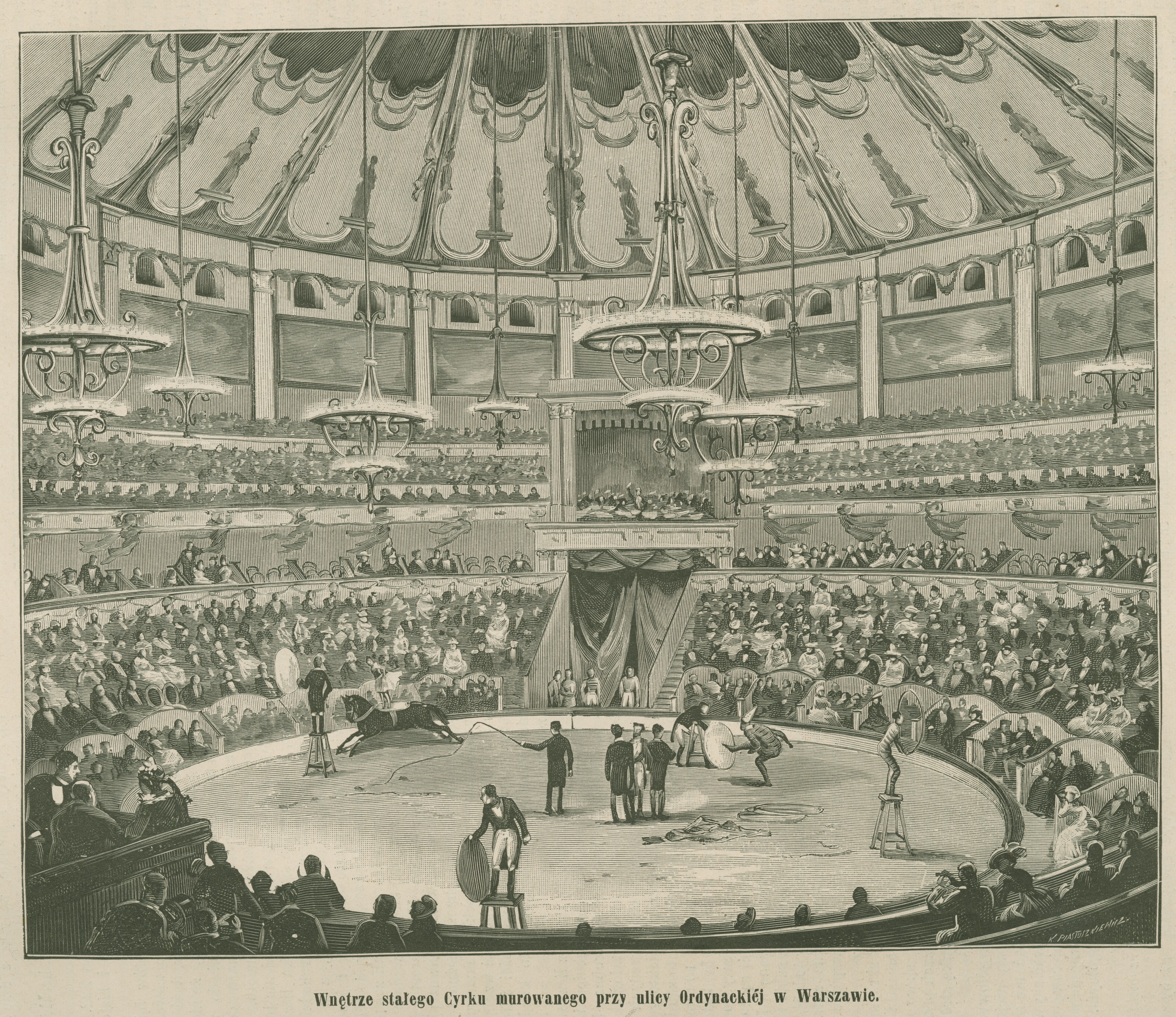 Ein altes Schwarz-Weiß-Zeichnung eines Zirkus-Szenen mit Menschen auf der Bühne, einige sitzend, und Kronleuchter von der Decke hängend, mit Text unten.