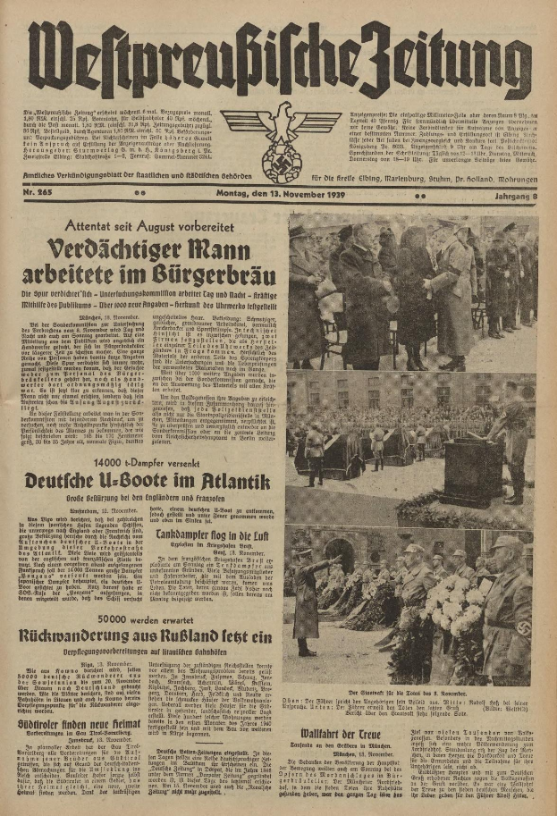 Schwarze-Weiß-Titelseite einer deutschen Zeitung vom 13. November 1939 mit der Überschrift 'Weitpreubliche Zeitung', die eine Gruppe von Menschen in traditioneller deutscher Kleidung in einer feierlichen Pose zeigt.