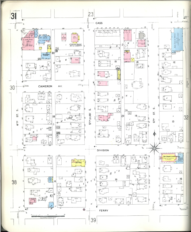 Altes Buch mit einer Stadtkarte aus den 1920er Jahren auf dem Cover, das Gebäudeanordnungen, Straßen, Parks und Sehenswürdigkeiten zeigt.