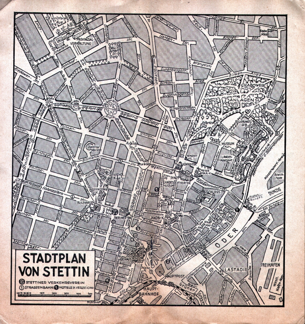 Ein alter, detaillierter Stadtplan von Stuttgart auf Papier, der Straßen, Gebäude und Sehenswürdigkeiten zeigt, mit zusätzlichem Text.