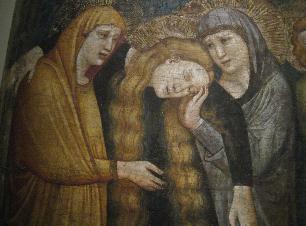 Ein abstraktes Gemälde mit verschiedenen Formen und Farben.