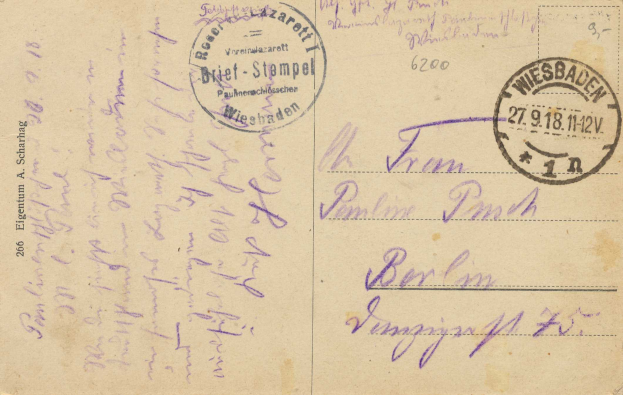 Eine alte Postkarte mit einem violetten 'Wiesbaden, Germany - 1st Weltkrieg' Stempel und handgeschriebener Text.