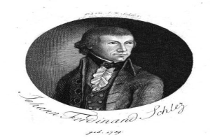 Schwarz-weißes Porträt von Johann Ferdinand Schley, einem deutschen Komponisten, der einen Mantel trägt, mit begleitendem Text.