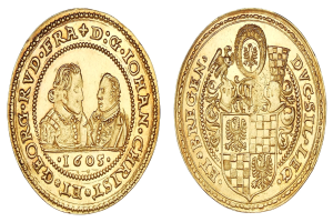 Goldmünze mit einem Wappen, Text und dekorativen Bildern auf einem weißen Hintergrund.